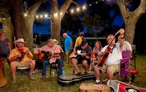 Picking at the campfire at Thomas Michael Riley's Festival