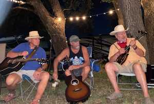 Picking at the campfire at Thomas Michael Riley's Festival
