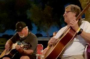 Picking at the campfire at Thomas Michael Riley's Festival